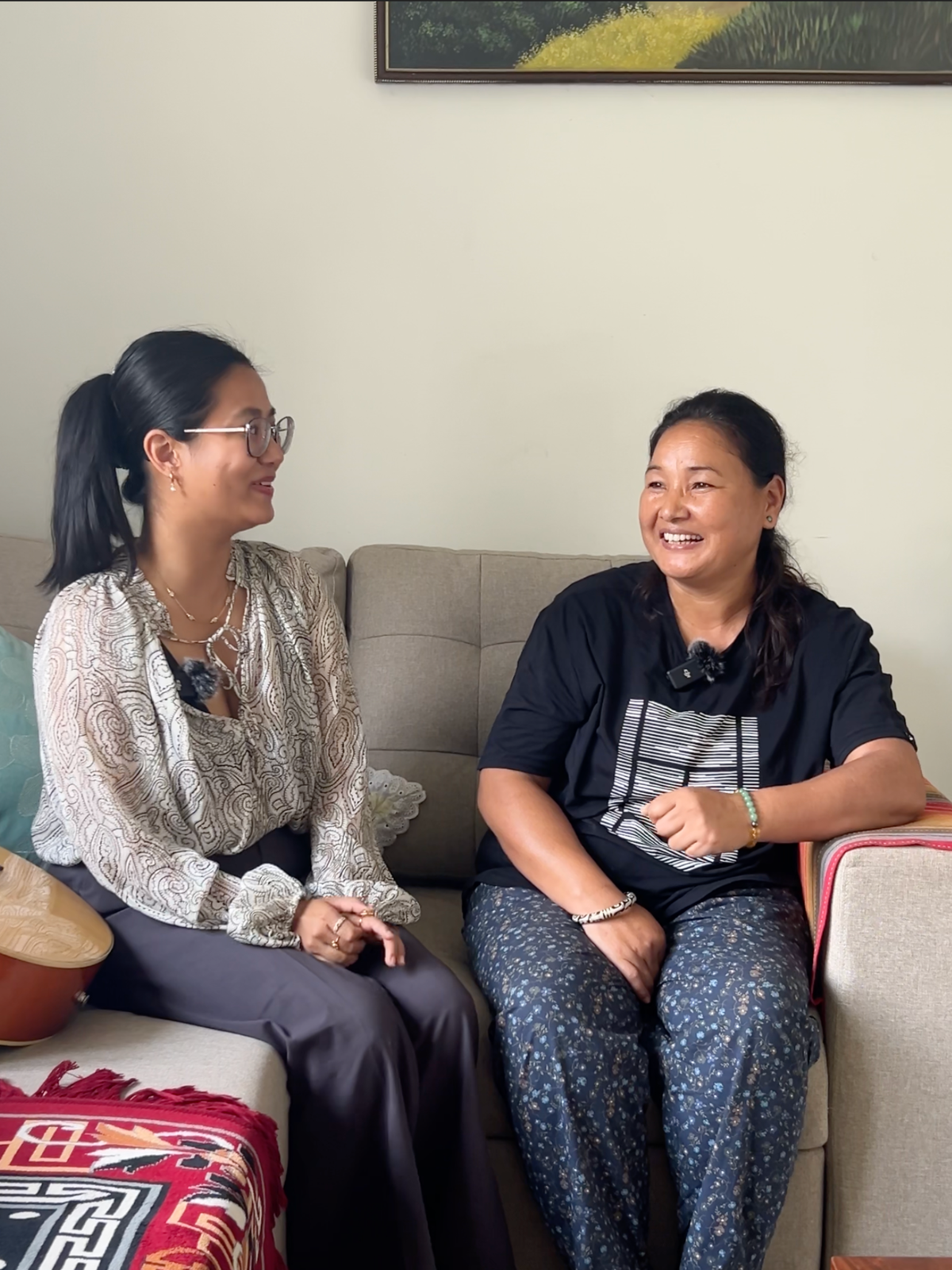 Swikriti, founder of Himali Cup, talking with tea maker Yankhu